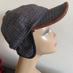 - Stetson  long brimmed Stetson hat with ear flaps